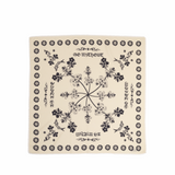 Beige bandana with black floral and text design on a beige background